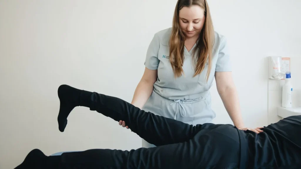 Practitioner working with a patient toward lasting lower back pain relief