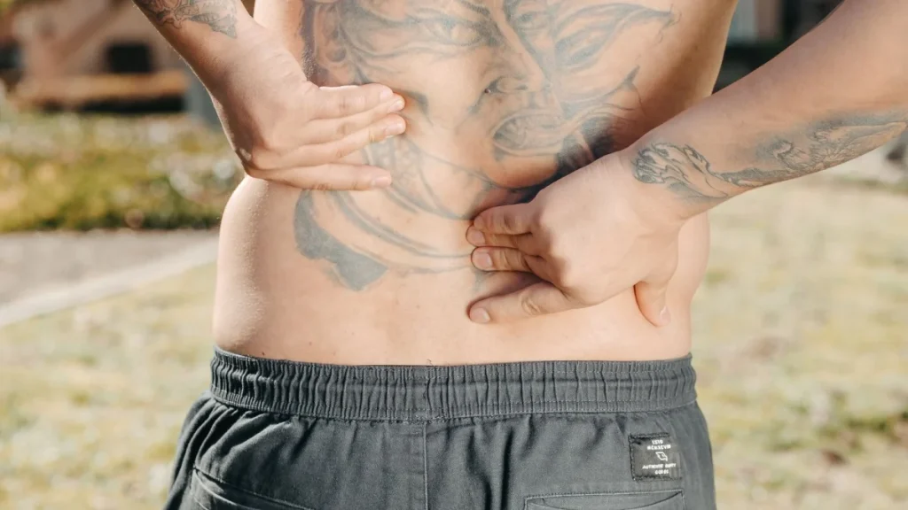Person with lingering back pain during the chronic phase of disc healing