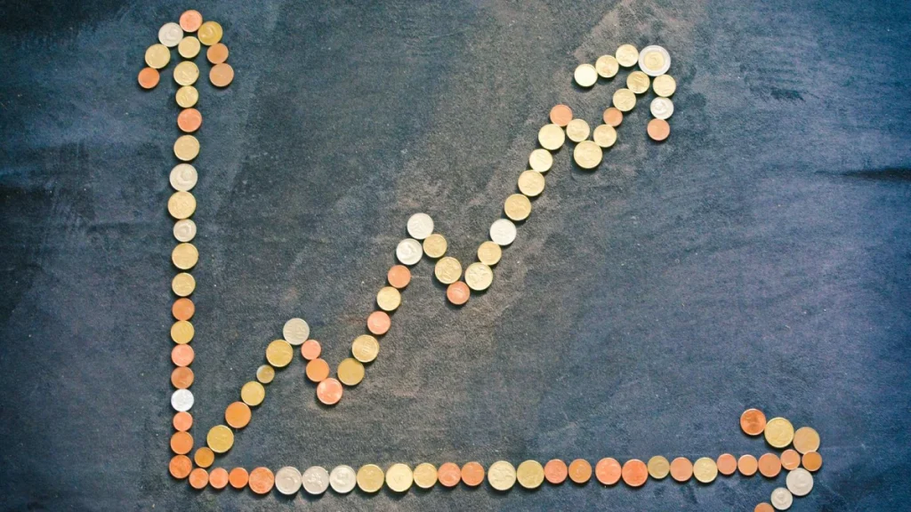 Upward graph made of coins, showing financial growth for chiropractors