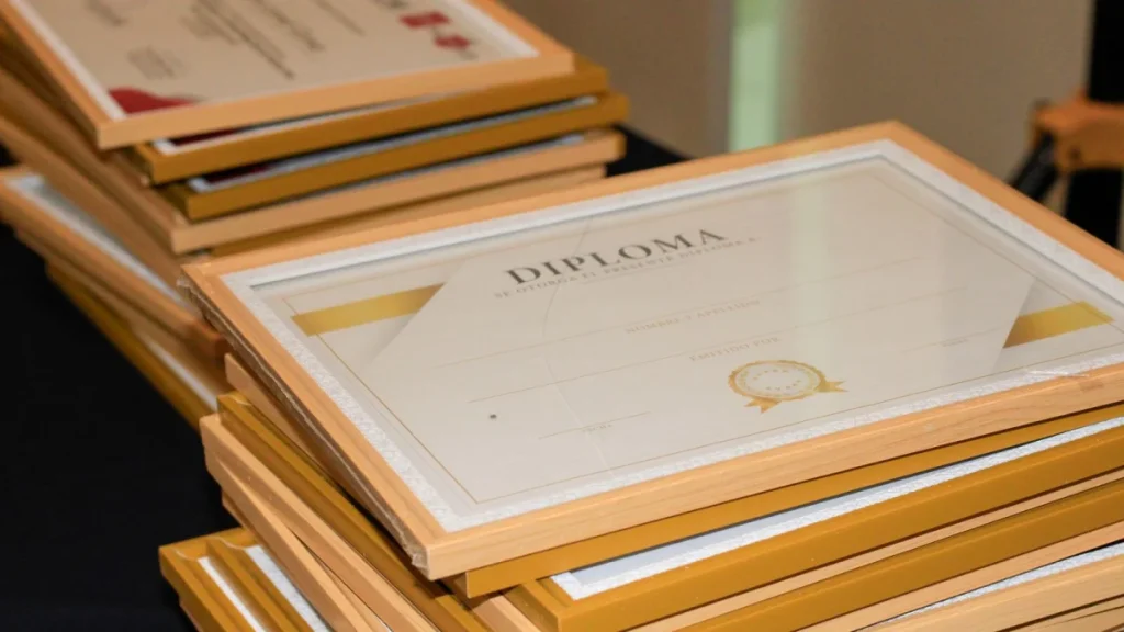 Stack of framed diplomas, reflecting the formal recognition chiropractors receive