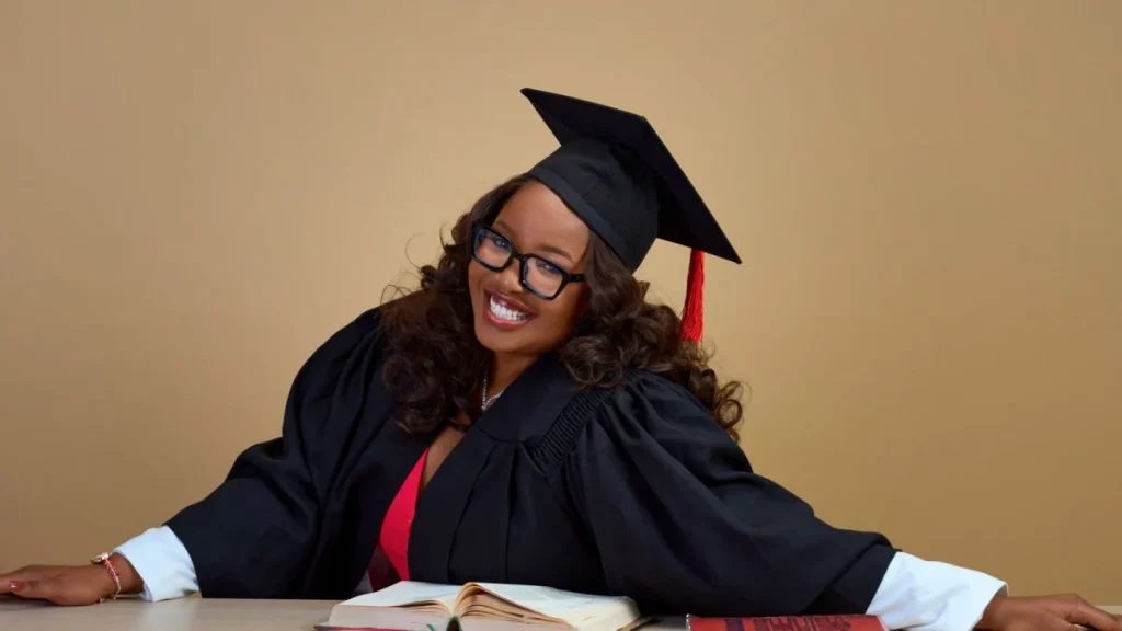 Smiling graduate celebrating the first big step toward becoming a chiropractor