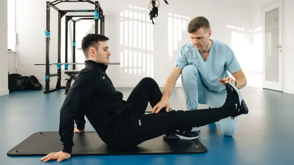 Patient exercising under a therapist's care for herniated disc recovery