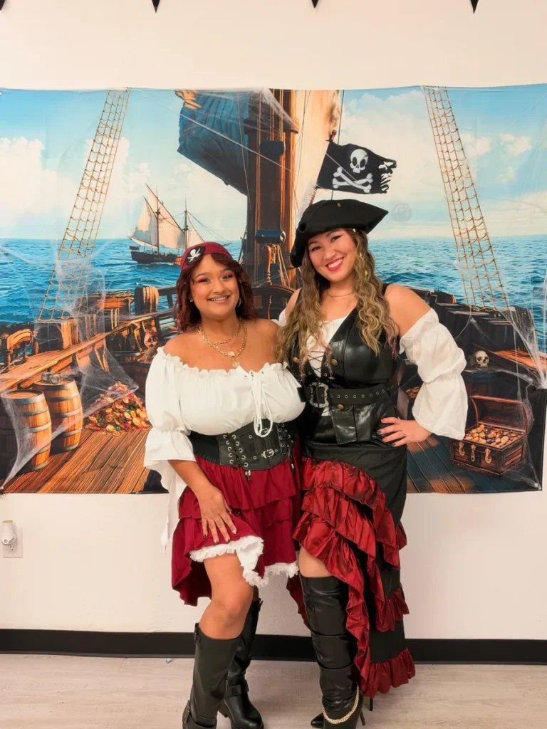 Two Spine and Injury Associates Haines City team members in pirate costumes for Halloween