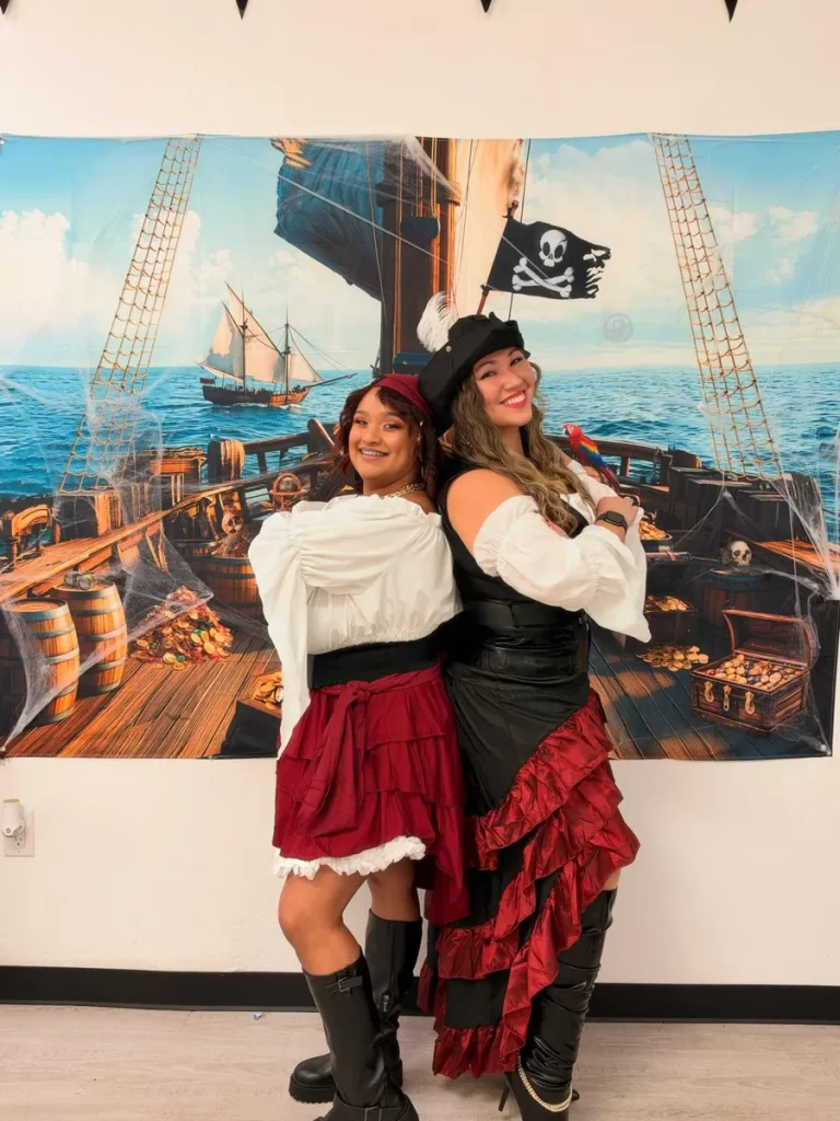 Spine and Injury Associates Haines City staff posing as pirates on Halloween 2026