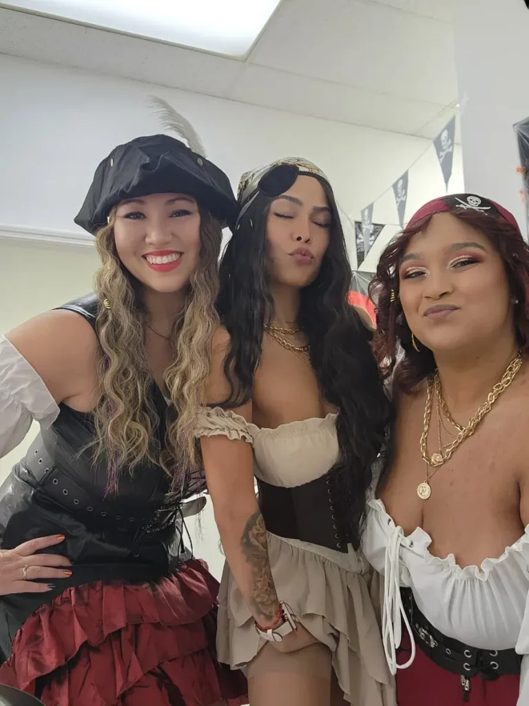 Three Spine and Injury Associates Haines City team members in pirate costumes