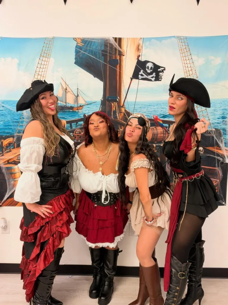 Spine and Injury Associates Haines City team posing as a pirate crew for Halloween 2026