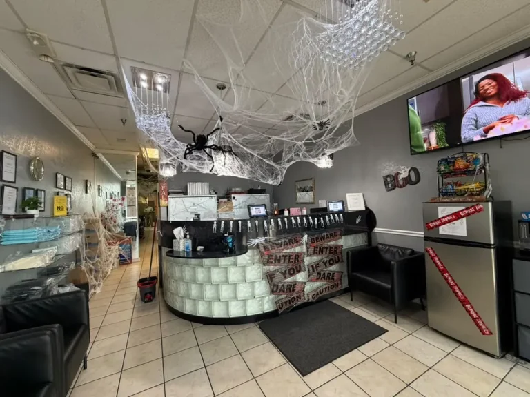 Spider webs and Halloween decorations at the front desk of the Spine and Injury Associates Orlando clinic