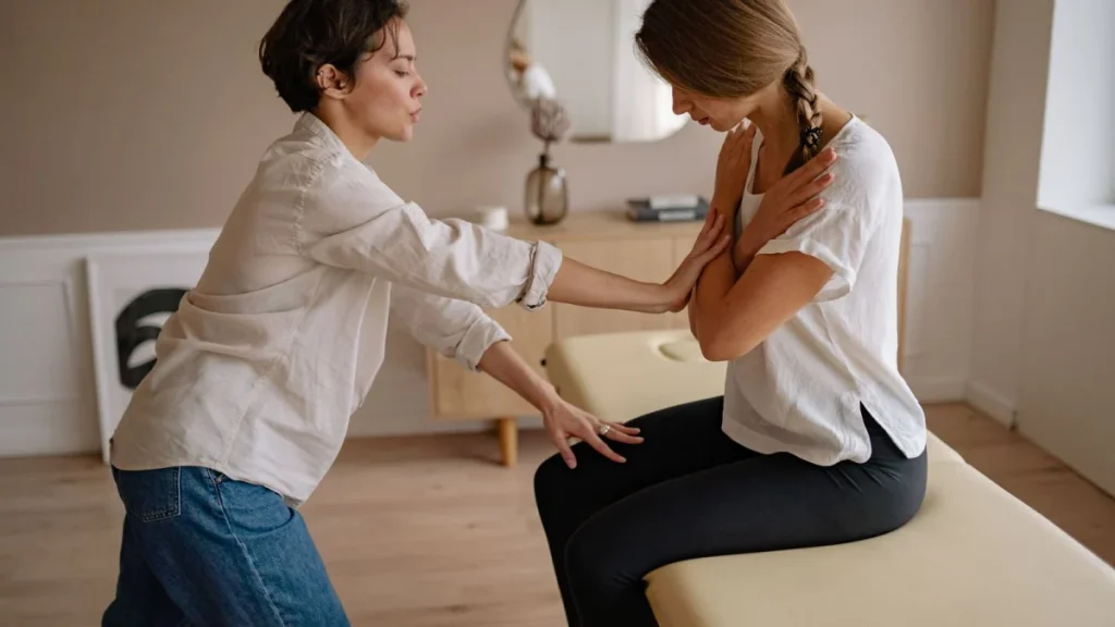 Patient talking with a practitioner about the limits of care for lower back pain