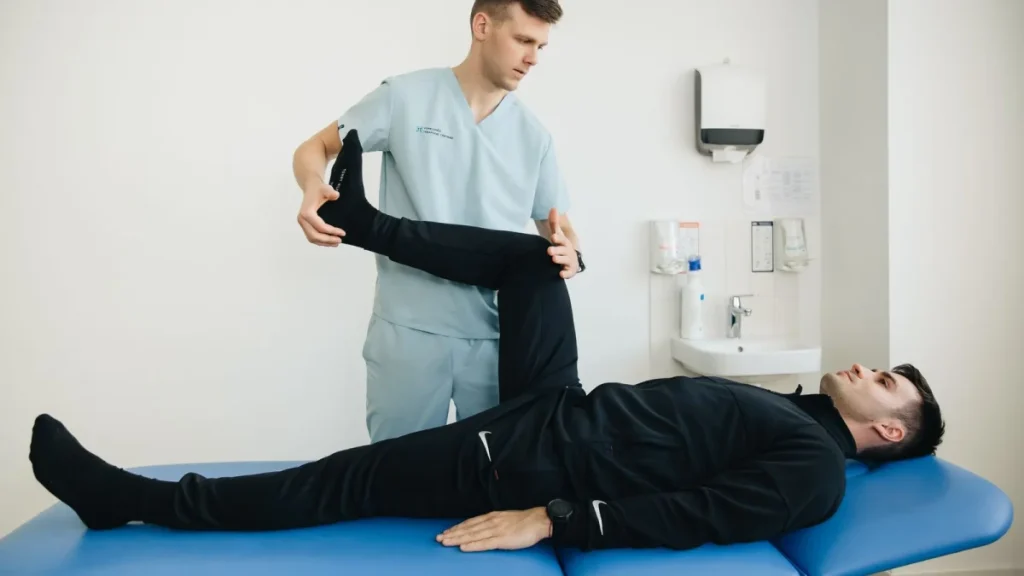 Physiotherapist and patient exercising together, a typical physical therapy treatment approach