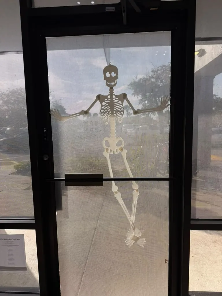 Skeleton decoration on the entrance door of the Spine and Injury Associates Plant City clinic