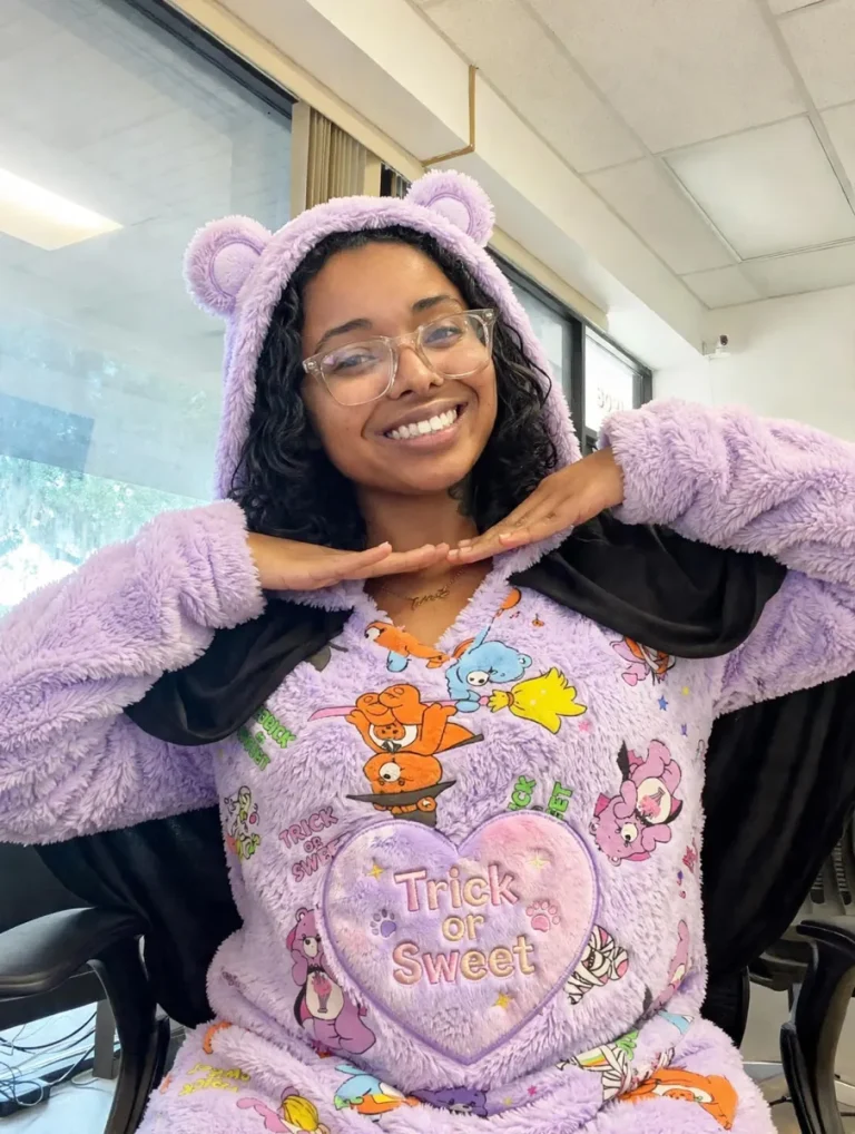 Spine and Injury Associates Plant City team member in a purple bear onesie for Halloween 2026