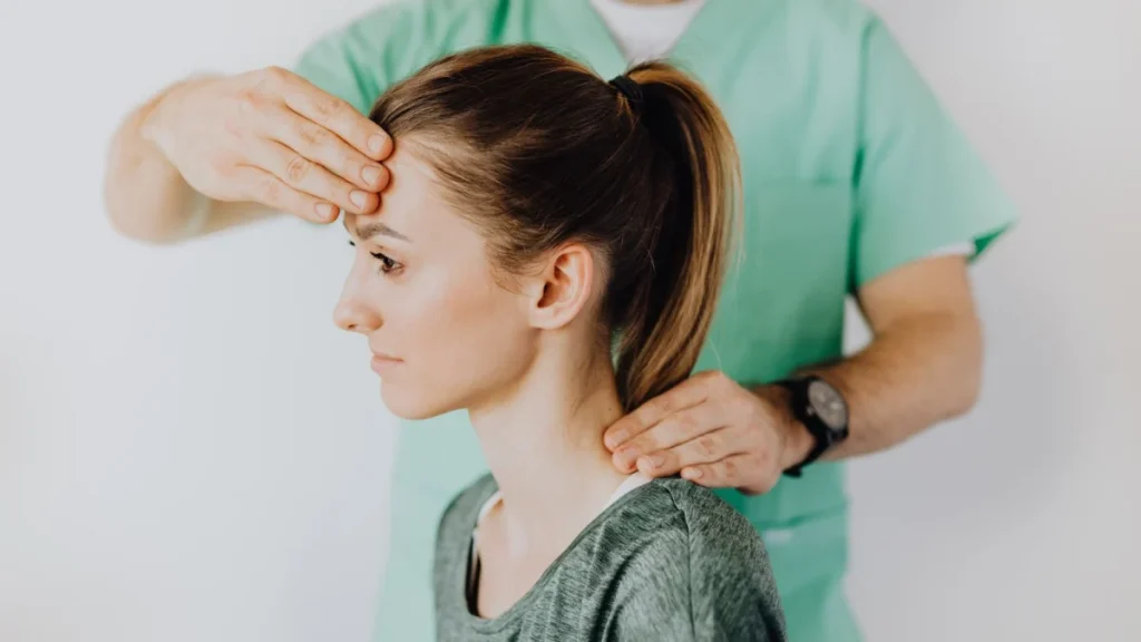 Practitioner treating a patient's neck, showing the trusted role chiropractors play