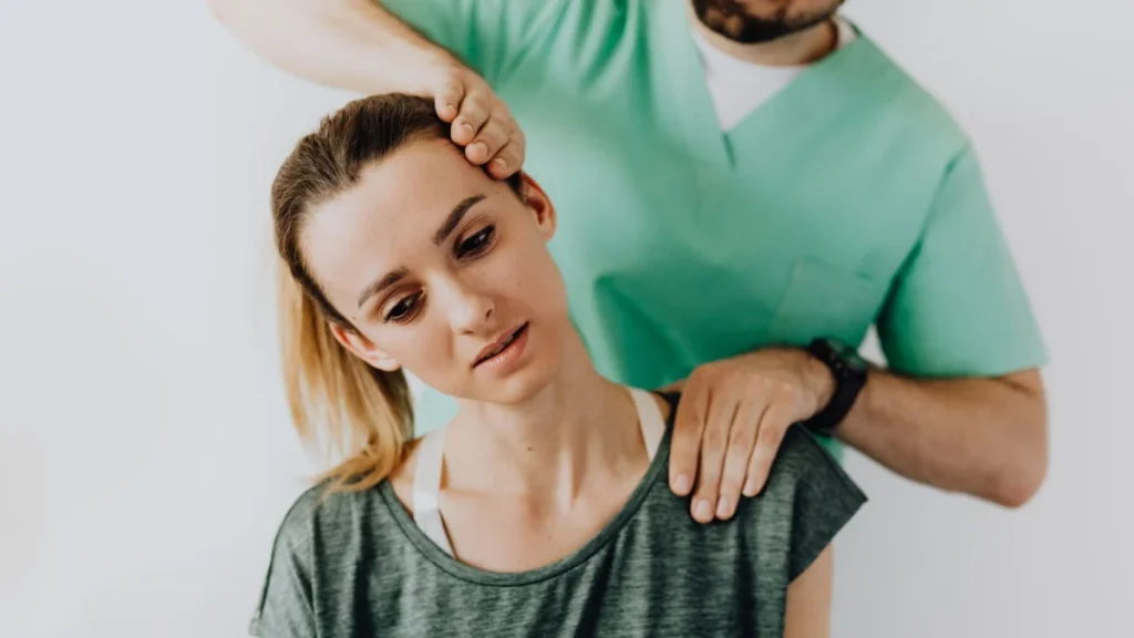 Practitioner treating a woman's neck for quick and lasting neck pain relief