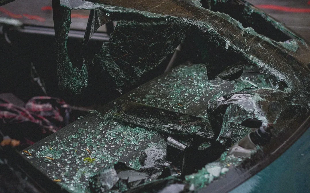 Shattered car windshield after a crash, one reason to see a car accident chiropractor