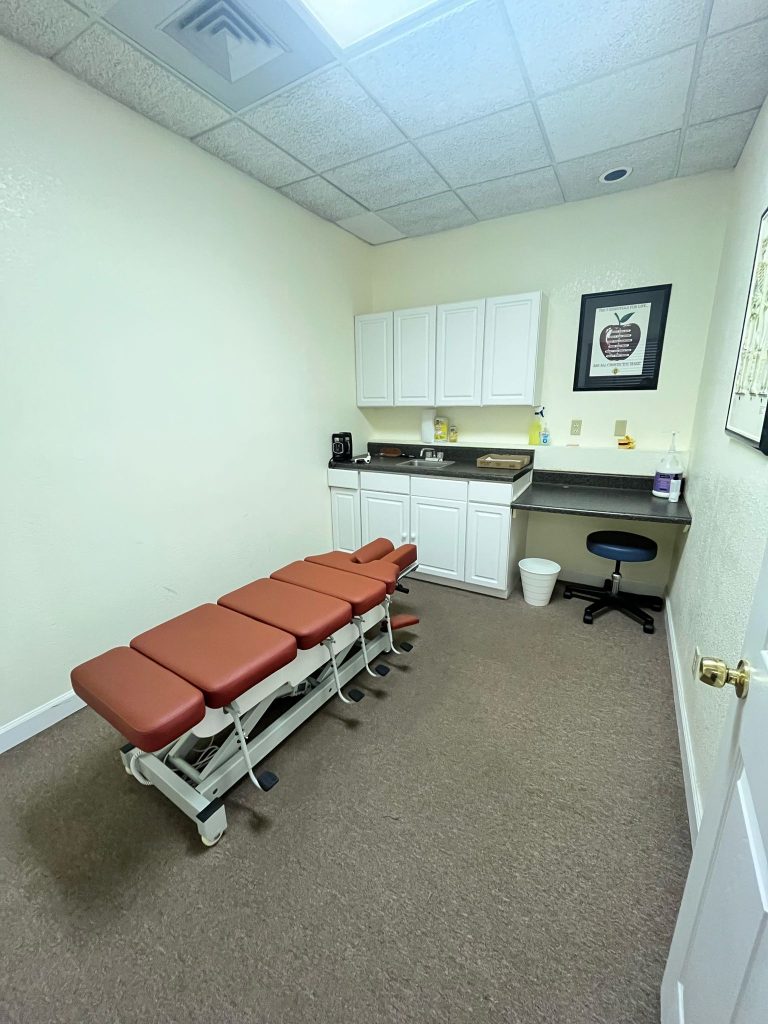 Treatment room with roller tables at Spine and Injury Associates Ocala