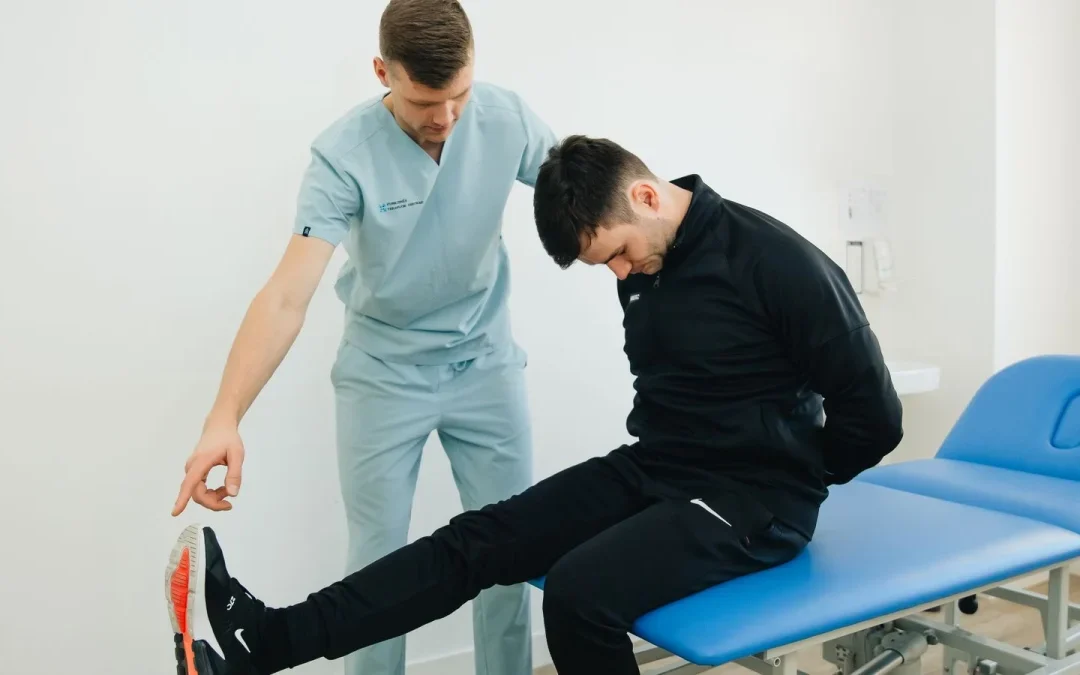 Therapist coaching a patient through movements as part of sciatica treatment