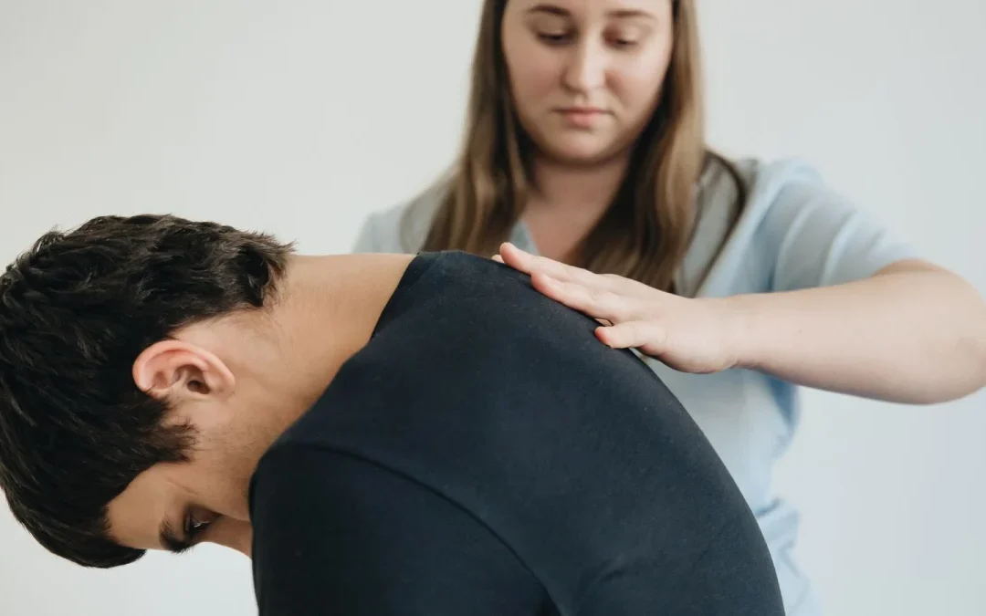 Therapist guiding a patient through back exercises during herniated disc recovery