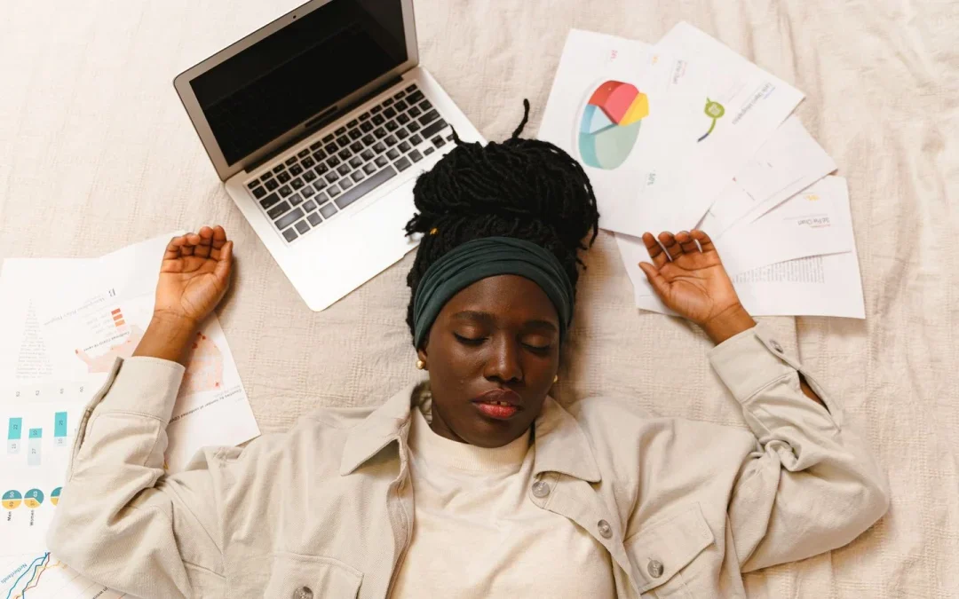 Tired woman lying down, reflecting the fatigue many people with fibromyalgia feel