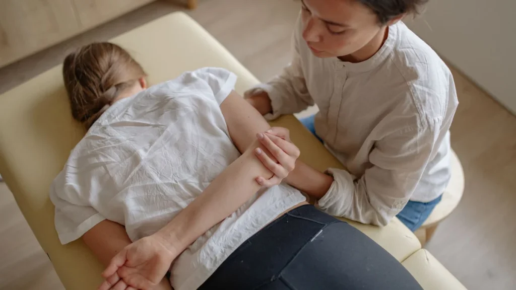 Woman receiving chiropractic therapy, reflecting the whole-body philosophy of chiropractic care